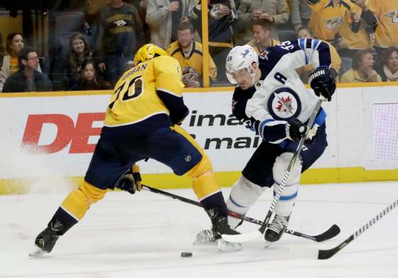 Nashville Predators defenseman P.K. Subban blocks the path of Winnipeg Jets center Mark Scheifele (55) in the third period of an NHL hockey game Tuesday, Dec. 19, 2017, in Nashville, Tenn. (AP Photo/Mark Humphrey)