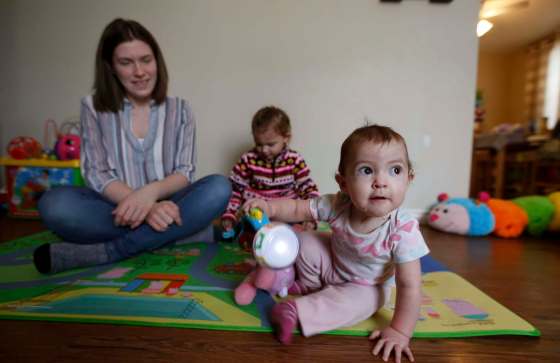 WAYNE GLOWACKI / WINNIPEG FREE PRESSAshton Kehler and her one year old miracle baby Lily at right, and daughter Aria, 3.