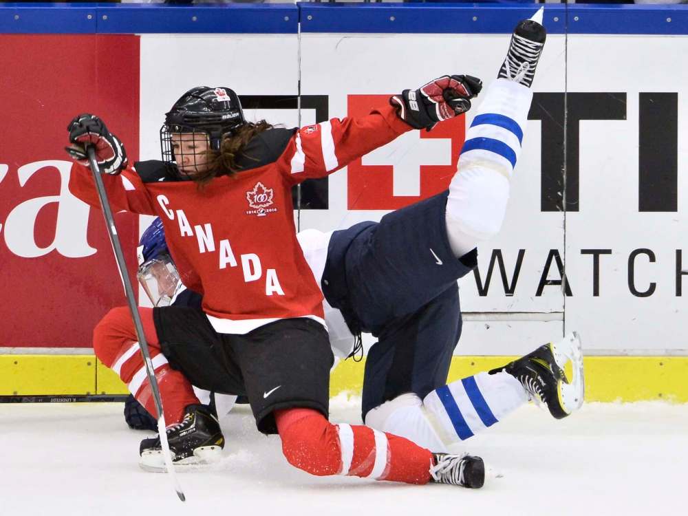 Finland's Rosa Lindstedt, rear, collides with Canada's Jocelyne Larocque during their 2015 IIHF Women's Hockey World Championship group A match between Canada and Finland at Malmo Isstadion in Malmo, southern Sweden in 2015. (AP Photo / Claudio Bresciani, TT)