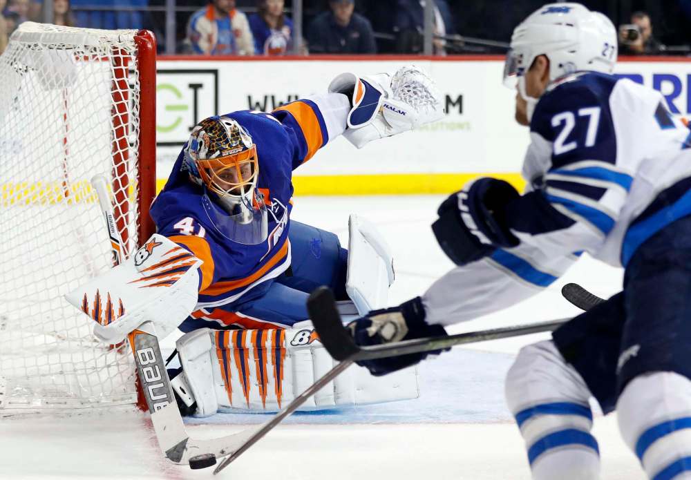 Islanders goalie Jaroslav Halak makes a save against Nikolaj Ehlers in the third period. (Adam Hunger / The Associated Press)