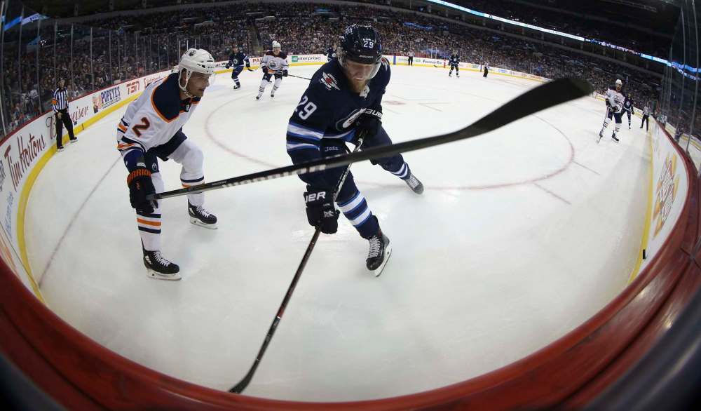 TREVOR HAGAN / WINNIPEG FREE PRESS
Edmonton Oilers' Andrej Sekera (2) battles with Winnipeg Jets' Patrik Laine (29) during the second period.