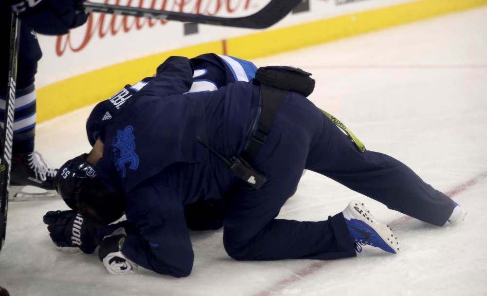 TREVOR HAGAN / WINNIPEG FREE PRESS
Winnipeg Jets' Mark Scheifele (55) suffered an upper-body injury.