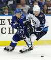 Chris O’Meara / The Associated Press files
Shaking off a back problem, Jets defenceman Dmitry Kulikov (right) has regained his confidence and is playing as well as he ever has.