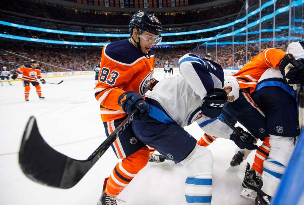 Jason Franson
/ The Canadian Press
Winnipeg Jets' Shawn Matthias (16) and Edmonton Oilers' Matthew Benning (83) battle in the corner during third period NHL action in Edmonton on Sunday, December 31, 2017.