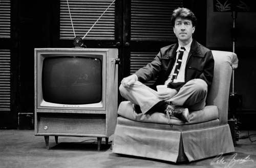 PETER BRAATZ PHOTO
David Lynch sits near a TV in this behind-the-scenes look by Super-8 movie-maker Peter Braatz, during the making of Blue Velvet in 1985.