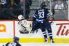 Winnipeg Jets' Dustin Byfuglien (33) checks Buffalo Sabres' Zemgus Girgensons (28) during third period NHL action in Winnipeg on Friday, January 5, 2018. THE CANADIAN PRESS/John Woods