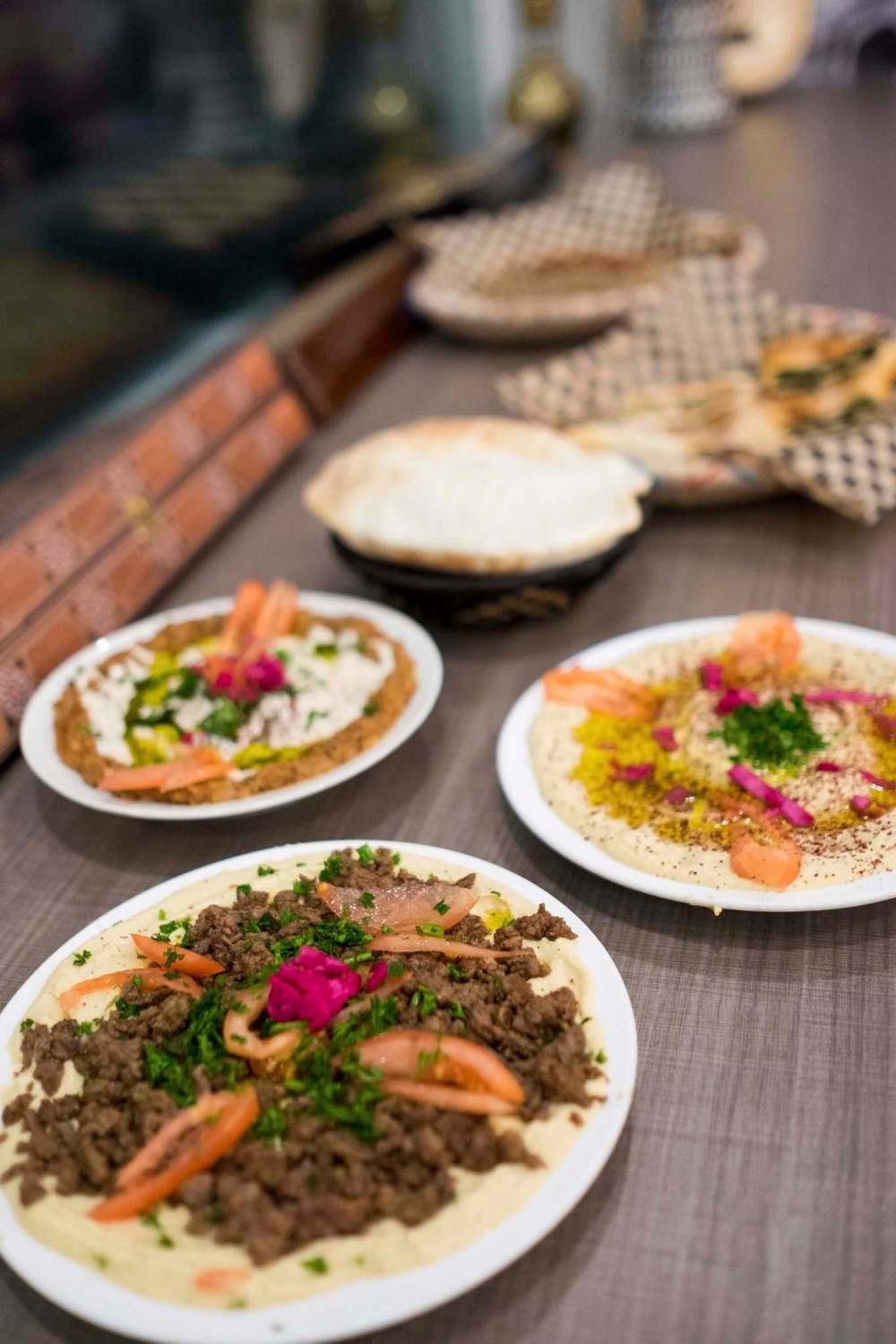 photos by Daniel Crump / Winnipeg Free Press
Yafa Café’s Foule Mudammas (left), Musakhan Chicken (centre) and Hummus.
