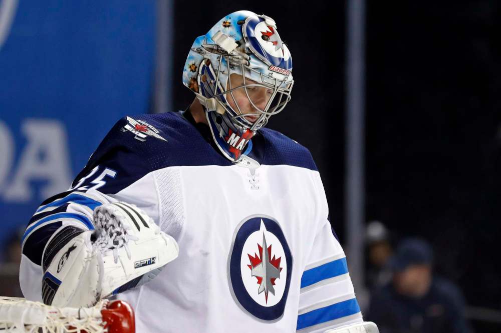Winnipeg Jets goalie Steve Mason reacts against the New York Islanders in the second period of an NHL hockey game, Saturday, Dec. 23, 2017, in New York. (AP Photo/Adam Hunger)