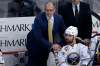 Buffalo Sabres head coach Dan Bylsma stands behind Zach Bogosian (47) during the third period of an NHL hockey game against the Pittsburgh Penguins in Pittsburgh, Sunday, March 5, 2017. THE CANADIAN PRESS/AP/Gene J. Puskar