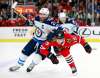 (AP Photo/Jeff Haynes)
Winnipeg Jets centre Blake Wheeler and Chicago Blackhawks centre Jonathan Toews vie for the puck during the first period, Friday in Chicago.