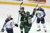 STACY BENGS / THE ASSOCIATED PRESS
The Minnesota Wild's Mikael Granlund looks back at teammate Jason Zucker after scoring a goal, to the displeasure of Winnipeg Jets Joel Armia and Toby Enstrom in the first period of Saturday's game.