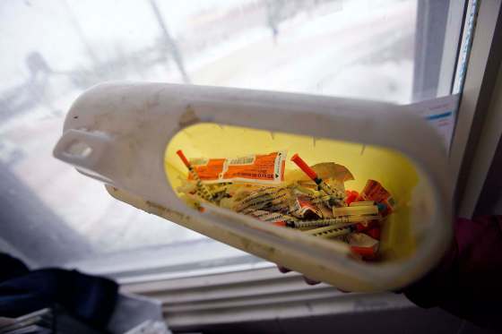 PHIL HOSSACK / Winnipeg Free PressWorkers at a Winnipeg shelter show needles in safe disposal containers they collect from clients.