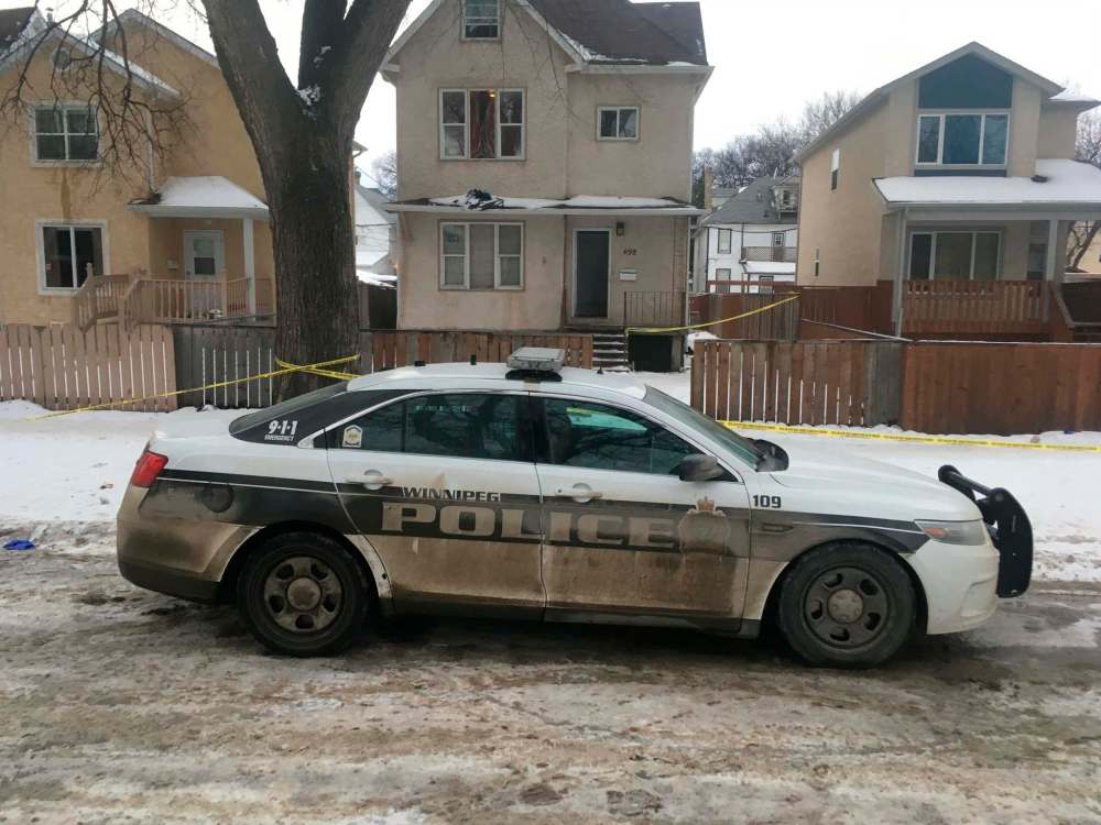 BORIS MINKEVICH / WINNIPEG FREE PRESS
A police cruiser is still on the scene on Furby Street on Friday morning.