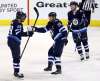 TREVOR HAGAN / THE CANADIAN PRESS
Winnipeg Jets' Patrik Laine (29), Blake Wheeler (26) and Kyle Connor (81) celebrate after Laine scored during first period NHL hockey action against the Vancouver Canucks, in Winnipeg, Sunday, January 21, 2018.