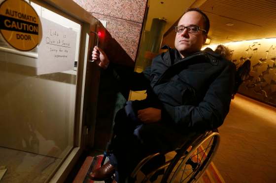 JOHN WOODS / WINNIPEG FREE PRESSAllen Mankewich in front of an out-of-order elevator in the course under Portage and Main in Winnipeg Tuesday. The elevator has been broken for a week and some people with disabilities can't navigate the stairs.