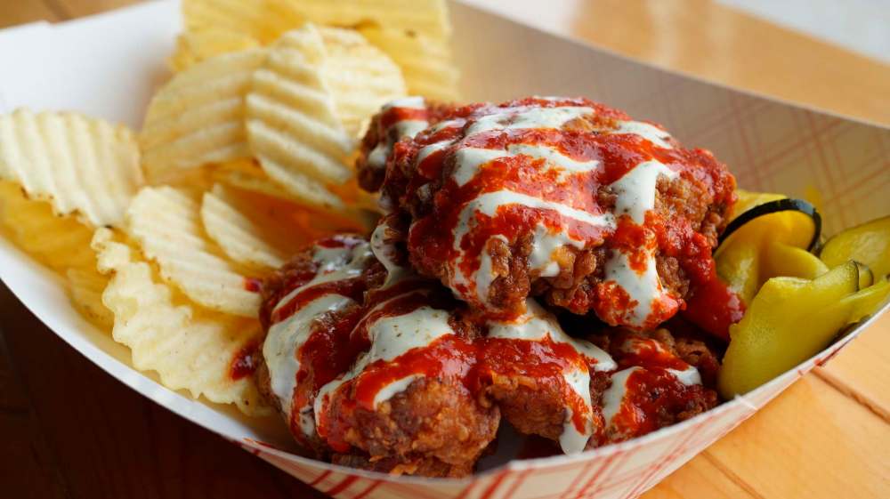 Have a Nice Day’s Fried Chicken Fest offering is a basic, yet scrumptious, two pieces of chicken drizzled in ranch dressing and hot sauce in a basket with ripple chips and pickles.