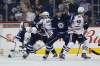 John Woods / The Canadian Press files
Winnipeg Jets defencemen Ben Chiarot (left) and Tucker Poolman clear traffic in front of goalie Connor Hellebuyck during a game against the Chicago Blackhawks in December.