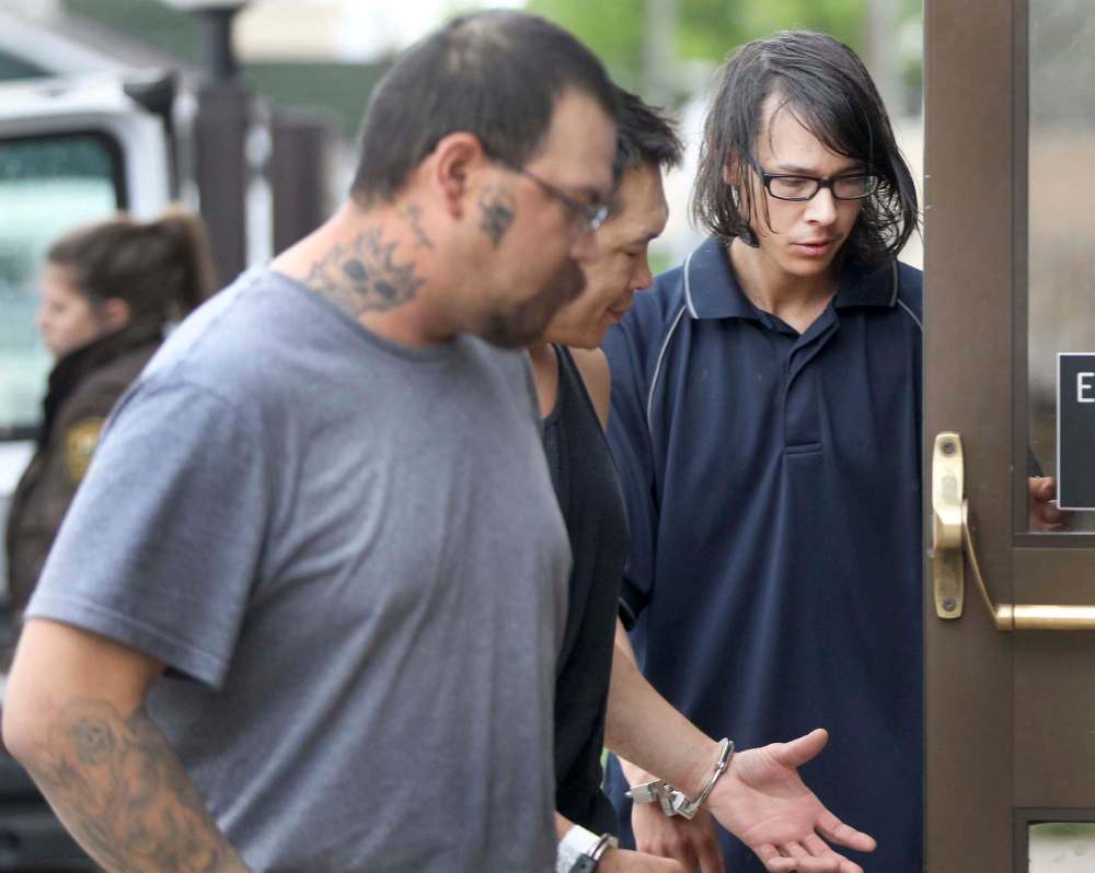 JOE BRYKSA / WINNIPEG FREE PRESS FILES
Jason Conway, 21, of MacGregor, Manitoba, right, is led into the provincial court house in Portage la Prairie, MB. He pleaded guilt to second-degree murder in the 2014 slaying of Nielsen.
