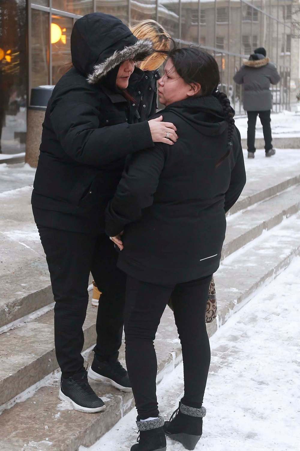 JOHN WOODS / WINNIPEG FREE PRESS
Tina Fontaine's mother, Tina Duck, right, is comforted by friends as she leaves the law courts  in Winnipeg, Tuesday.