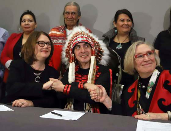 Fred Chartrand / The Canadian Press filesIndigenous Services Minister Jane Philpott (from left), Grand Chief Arlen Dumas and Northern Affairs Minister Carolyn Bennett shake hands after participating in a signing ceremony to improve child and family services in Manitoba First Nations communities last year.