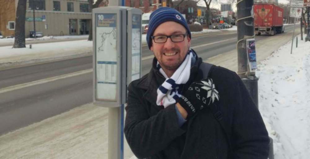 Supplied
Coun. Matt Allard waits for a Winnipeg Transit bus to take him to work in early January. The city representative is opting to take transit instead of driving on a permanent basis.