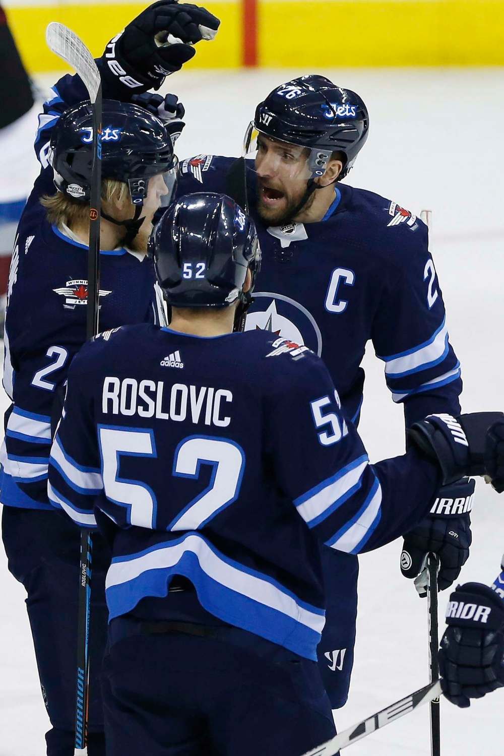 JOHN WOODS / THE CANADIAN PRESS
Winnipeg Jets' Patrik Laine (29), Jack Roslovic (52) and Blake Wheeler (26) celebrate Laine's goal against the Colorado Avalanche during the first period.