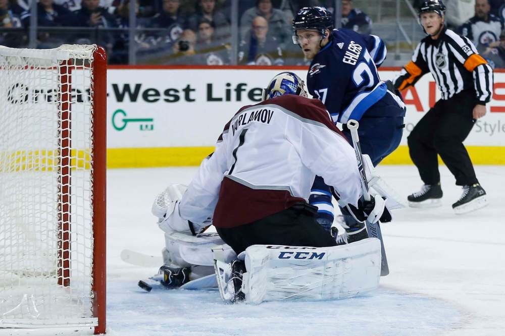 John Woods / The Canadian Press
Winnipeg Jets' Nikolaj Ehlers' (27) breakaway shot trickles through the pads of Colorado Avalanche's goaltender Semyon Varlamov (1), but hits the post during second period NHL action in Winnipeg on Saturday, February 3, 2018.
