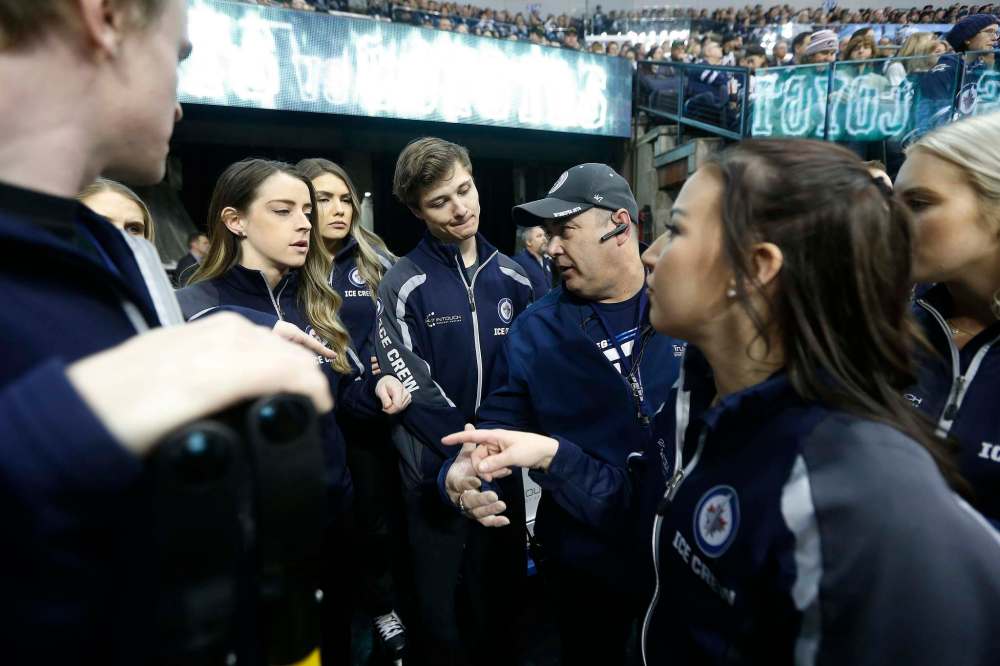 Nelson Nenka (right) leads a pep talk prior to the game.