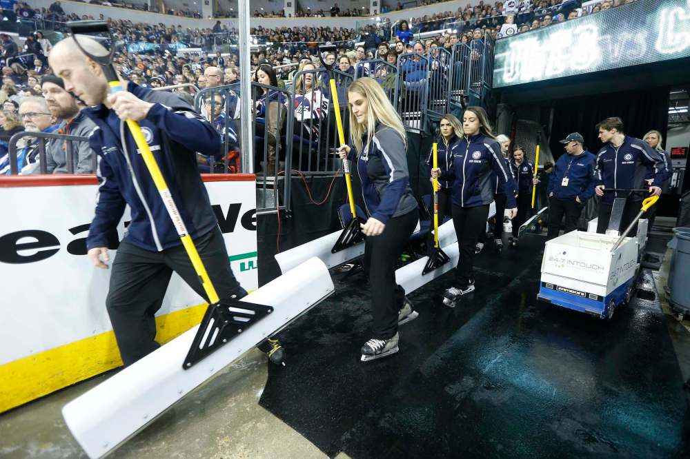 Members of the Ice Crew hit the ice.