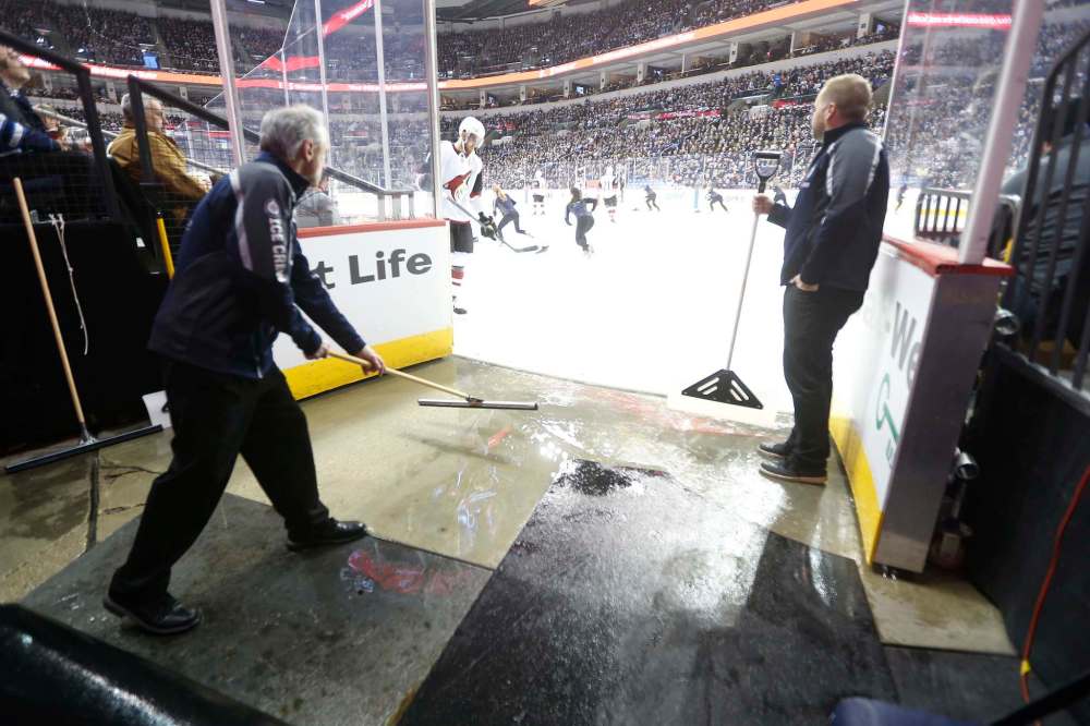 Kevin Cameron (left) and Paul Lazarenko keep the entrance clear.
