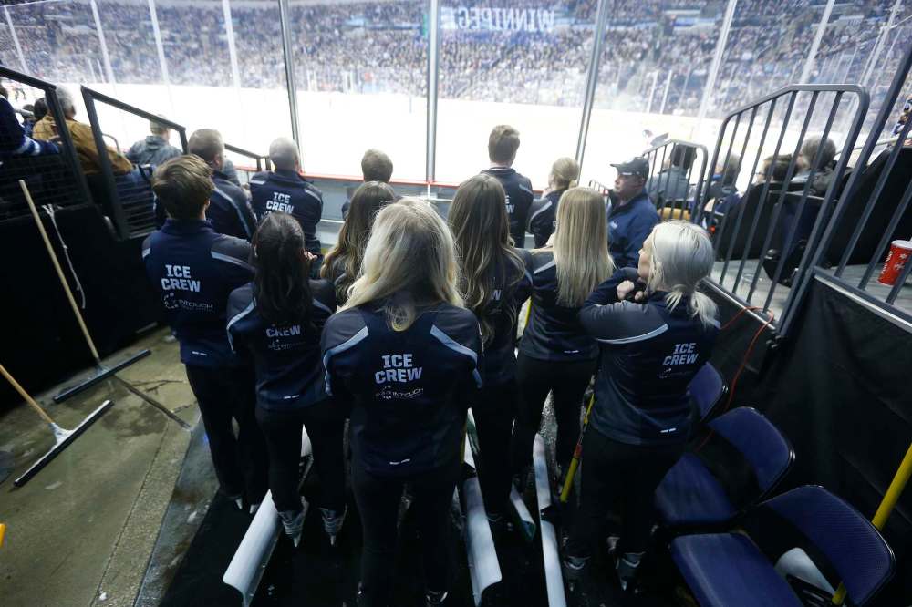 Members of the Ice Crew wait to hit the ice.