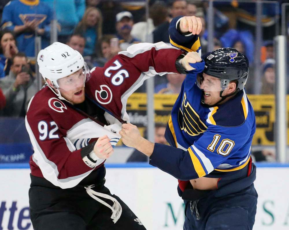 Colorado Avalanche left wing Gabriel Landeskog, left, fights with St. Louis Blues center Brayden Schenn early in the first period Thursday in St. Louis. (Chris Lee / St. Louis Post-Dispatch)