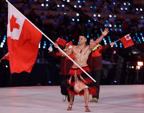 Petr David Josek / The Associated Press
Pita Taufatofua carries the flag of Tonga during the opening ceremony of the 2018 Winter Olympics in Pyeongchang, South Korea, on Friday.