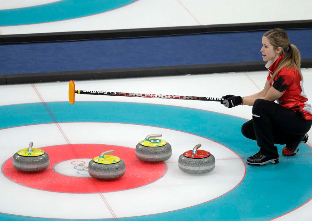 Aaron Favila / The Associated Press
Canada's Kaitlyn Lawes holds her stick during their mixed doubles curling finals match against Switzerland.