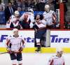 Jay Beagle leaves the ice after being slashed by Dustin Byfuglien. (Trevor Hagan / The Canadian Press)
