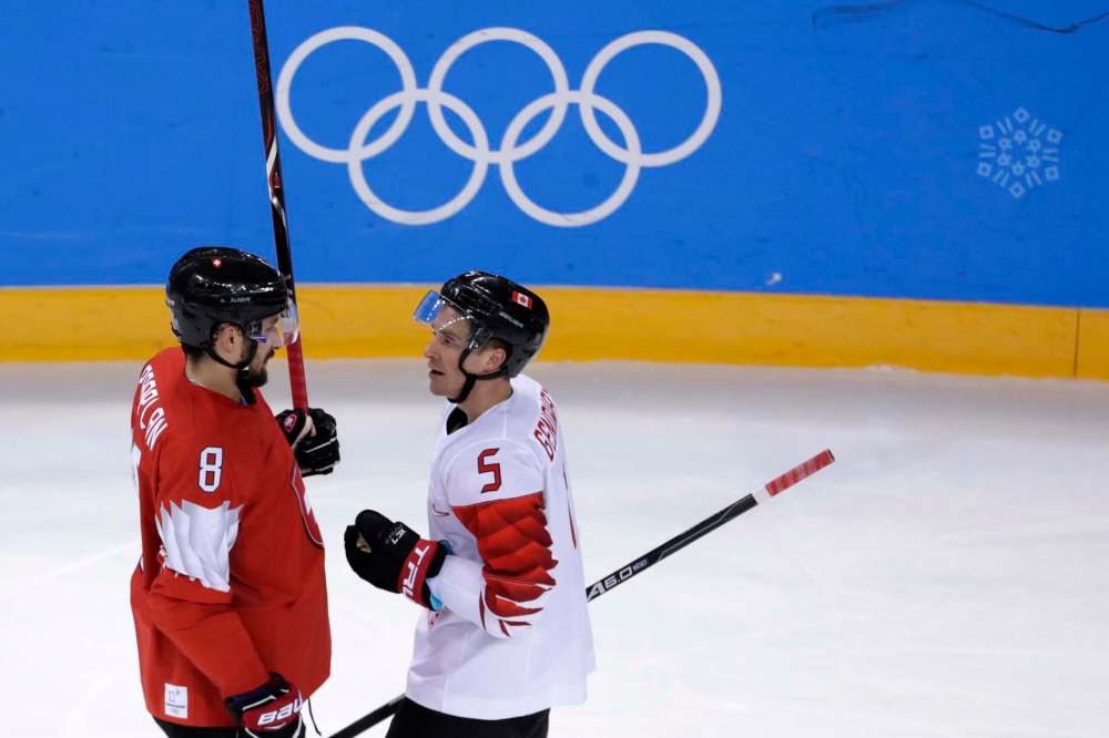 Julio Cortez / The Associated Press
Switzerland’s Vincent Praplan, left, and Canada’s Chay Genoway stare each other down during Thursday’s game.