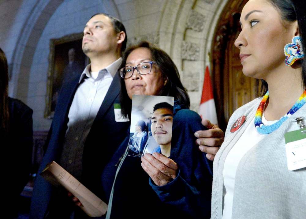 Justin Tang / The Canadian Press Files
Debbie Baptiste, surrounded by family members, holds up a photo of her son Colten Boushie after meeting with the prime minister in Ottawa on Tuesday.