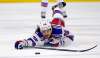 Mats Zuccarello dives for the puck during a game against the Carolina Hurricanes. (Karl B DeBlaker / Associated Press files)