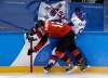 Matt Slocum / The Associated Press
Rob Klinkhammer (12), of Canada, checks Kim Won-jun (6), of South Korea, during the third period of the preliminary round of the men's hockey game at the 2018 Winter Olympics in Gangneung, South Korea, Sunday, Feb. 18, 2018.