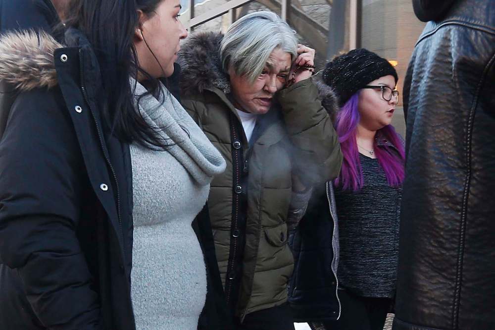 THE CANADIAN PRESS/John Woods
Thelma Favel, centre, Tina Fontaine's great-aunt and the woman who raised her, weeps as she enters the law courts in Winnipeg with family and supporters the day the jury delivered a not-guilty verdict in the second-degree murder trial of Raymond Cormier, Thursday.