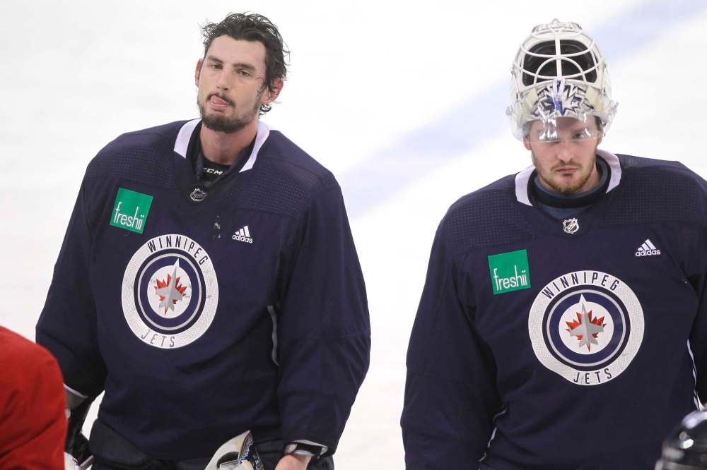 BORIS MINKEVICH / WINNIPEG FREE PRESS
Winnipeg Jets goalies Connor Hellebuyck, left, and Michael Hutchinson at team practice.
