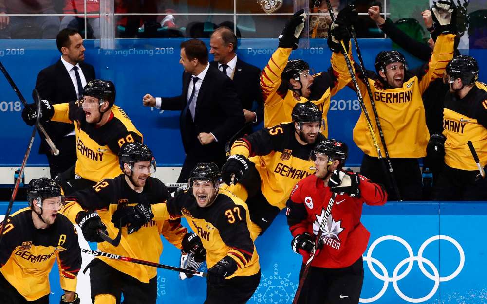 Germany's players celebrate winning their men's semifinal ice hockey match against Canada during the 2018 Winter Olympic Games, at the Gangneung Hockey Centre on Feb. 23, 2018 in South Korea. Team Germany won the game 4-3 and advances to the final against Olympic Athletes from Russia. (Valery Sharifulin/TASS/Zuma Press/TNS)