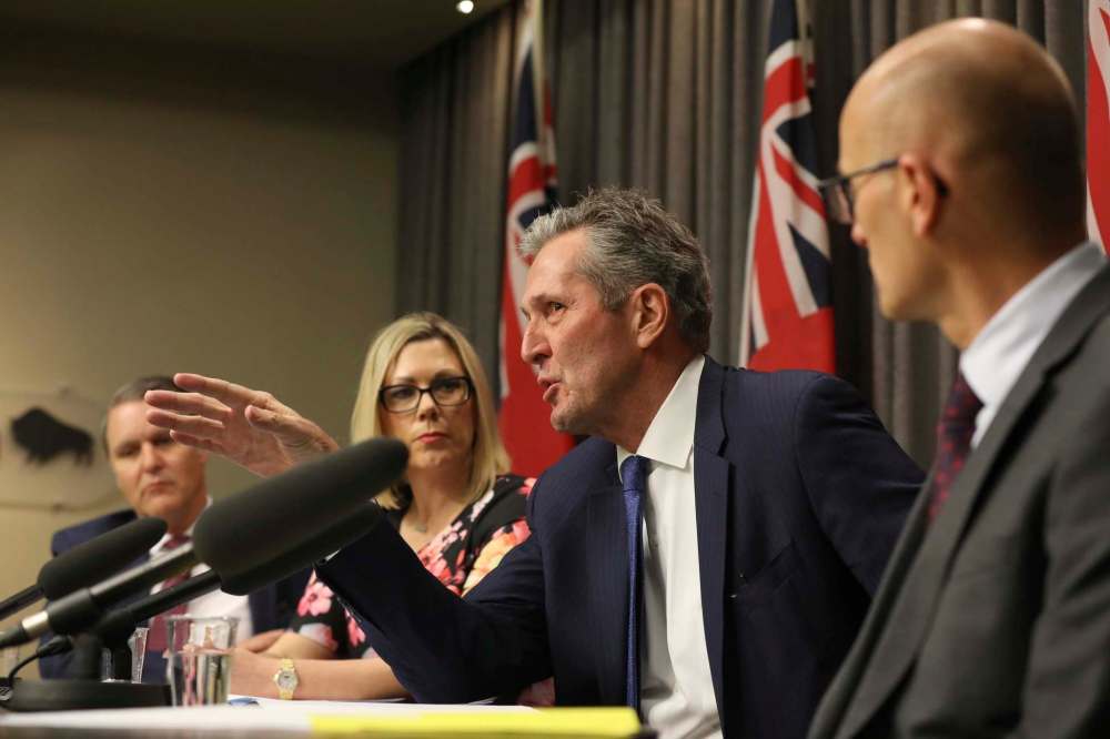 Premier Brian Pallister discusses sexual harassment policies, with Finance Minister Cameron Friesen (far left) and Rochelle Squires, minister responsible for the status of women. (Free Press file photo)