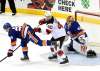 Bill Kostroun / The Associated Press
New Jersey Devils right wing Michael Grabner (40) checks New York Islanders center Brock Nelson (29) as Islanders goaltender Jaroslav Halak (41) watches during the third period of an NHL hockey game Saturday, Feb. 24, 2018, in Newark, N.J. The Devils defeated the Islanders 2-1.