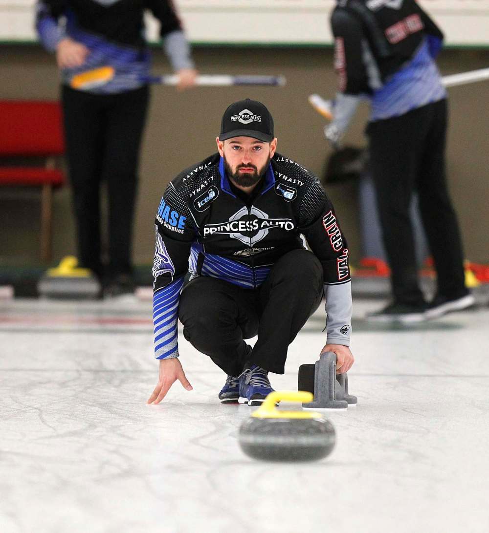 PHIL HOSSACK / WINNIPEG FREE PRESS - TEAM CARRUTHERS - Ried Carruthers watches his rock slide down ice during a practice session at the Granit CC Tuesday afternoon. See Jay Bell's story. - February 27, 2018