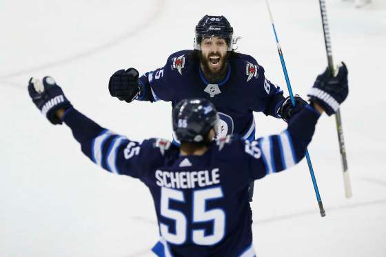 JOHN WOODS / WINNIPEG FREE PRESSMathieu Perreault and Mark Scheifele celebrate Scheifele's game tying goal against the Washington Capitals. “We could have easily won that game