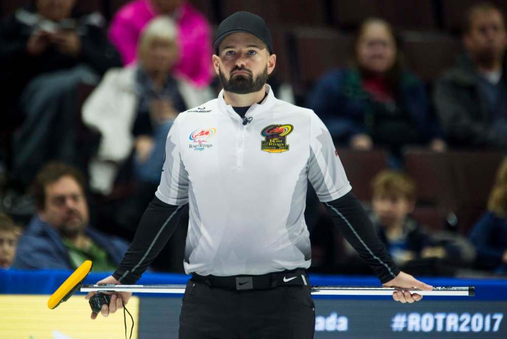 Skip Reid Carruthers from Winnipeg waits for the play to begin in the seventh end during Olympic curling trials action against Team Jacobs, Thursday December 7, 2017 in Ottawa. THE CANADIAN PRESS/Adrian Wyld
