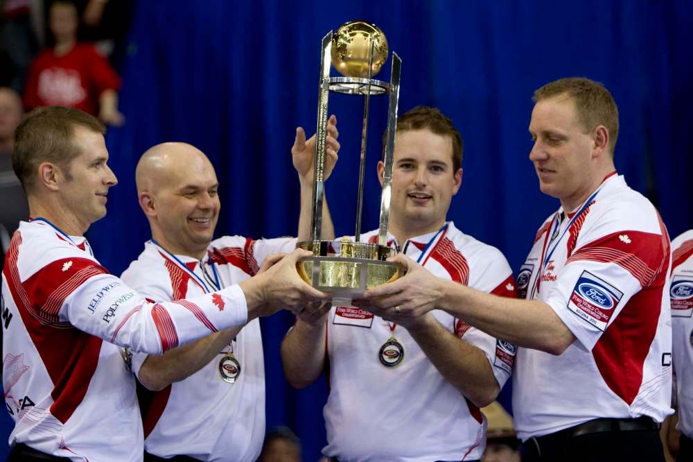 Canada skip Jeff Stoughton, left to right, third Jonathan Mead, second Reid Carruthers and lead Steve Gould celebrate their team's gold medal win over Scotland at the Ford World Men's Curling Championships in Regina, Sask., Sunday, April 10, 2011. THE CANADIAN PRESS/Jonathan Hayward