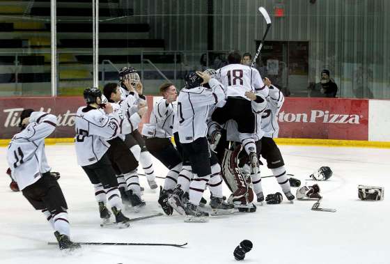 PHIL HOSSACK / WINNIPEG FREE PRESSSt. Paul’s Crusaders players celebrate their 7-2 victory over the Sturgeon Heights Huskies in game three of a WHSHL final Thursday evening.