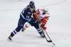 THE CANADIAN PRESS/John Woods
Winnipeg Jets' Patrik Laine and Detroit Red Wings' Andreas Athanasiou go for the loose puck during first period NHL action in Winnipeg on Friday.